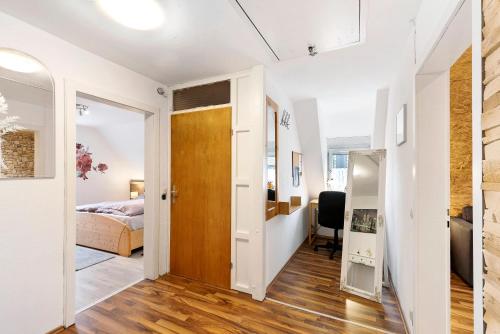 a room with a bed and a door leading to a bedroom at Ferienwohnung Nickel in Hofstetten