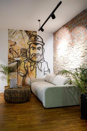 a room with a bed and a mural of a chef at Fewo Heimat - Bad Dürkheim in Bad Dürkheim
