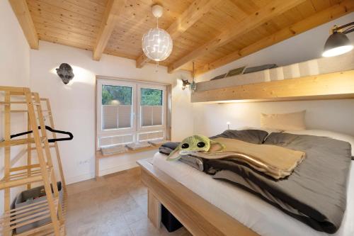 a bedroom with a bed with a star wars helmet on it at Ferienhaus mit Panoramablick in Gernrode