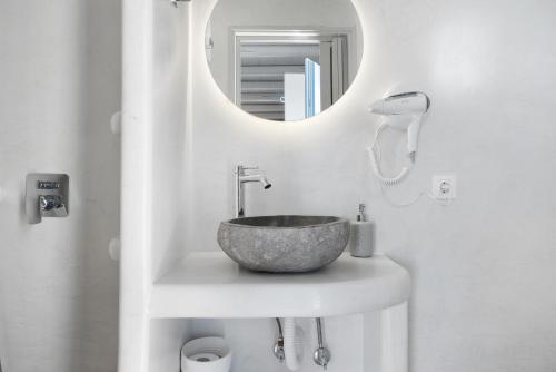 a bathroom with a bowl sink and a mirror at Nicolas House 4 in Rakhídhion