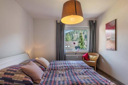 a bedroom with a bed and a window at Haus Gisela - Stockkamp in Todtmoos
