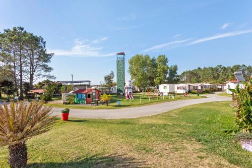 a park with a playground and a play area at Bungalow T3 I I -15 Min From Nazaré in Pataias