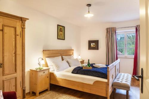 a bedroom with a bed and a window at Lina in Rottenbuch