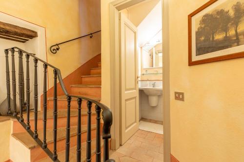 a hallway with a staircase leading to a bathroom at La Terrazza, Cetona, Toscana in Cetona