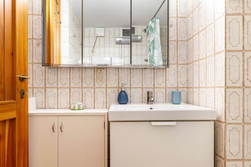 a bathroom with a sink and a mirror at Villa Franca San Zeno in San Zeno di Montagna