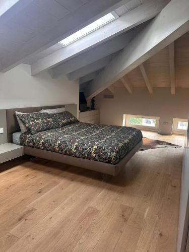 a bedroom with a bed in an attic at La dolce vita - Lake Iseo in Paratico