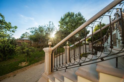 a view of a staircase from a house with the sun shining at La Casona Minera in Mineral de Pozos