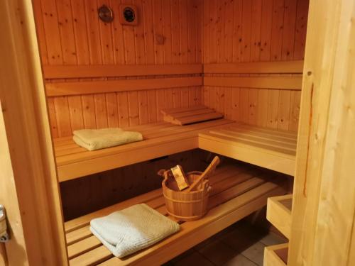 a sauna with wooden shelves and towels in it at Ferienwohnung Schöner in Oberharmersbach