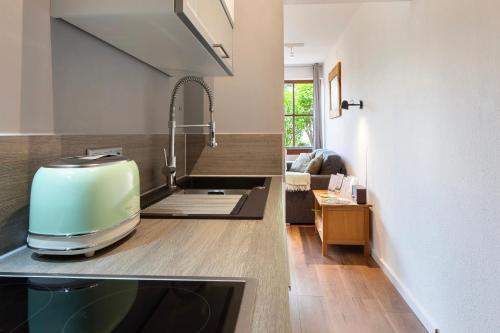 a kitchen with a toaster sitting on top of a counter at Ferienwohnung Am Mehlberg in Hinterzarten