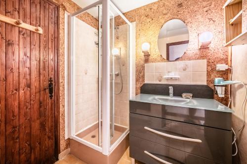 a bathroom with a sink and a shower at Chalet la Bartavelle - Morillon in Morillon