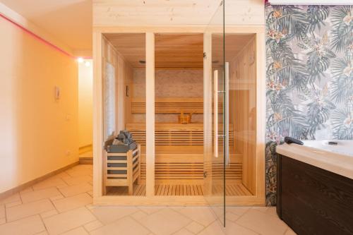 a bathroom with a walk in shower and a sink at Pretziosa in Castiadas