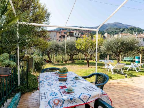 a table and chairs on a patio at Apartment Marisol by Interhome in Toirano