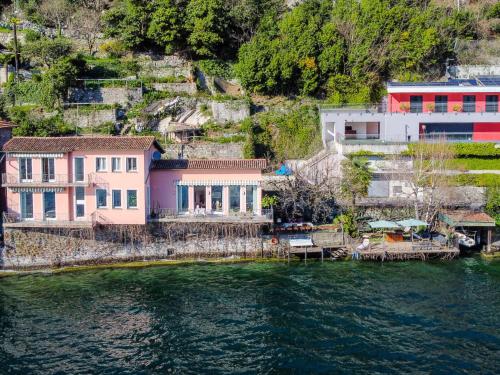 a group of houses on the shore of a body of water at Villa Casa Silvana by Interhome in Valsolda