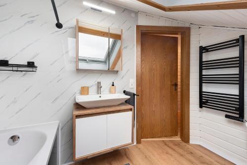 a bathroom with a sink and a mirror at Ferienwohnung Witt in Salem