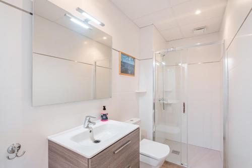 a bathroom with a sink and a shower at Casa La Mar in Santanyi
