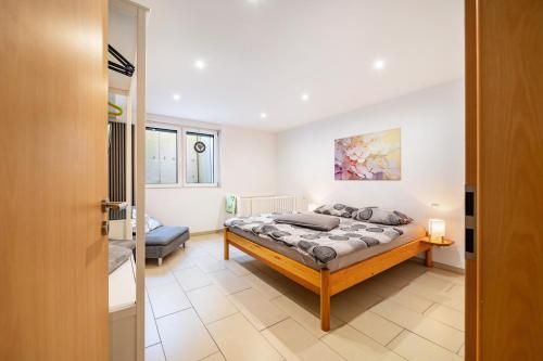 a bedroom with a bed in a room at Eifel im Herzen in Hambuch