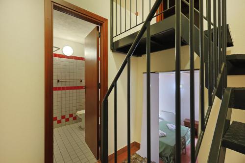 a staircase leading to a bathroom with a toilet at Ospitalità D'alunzio in San Marco dʼAlunzio