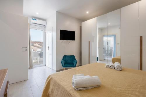 a bedroom with a bed with two towels on it at La Terrazza Di Porticello in Porticello