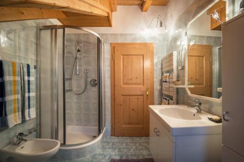 a bathroom with a shower and a sink and a toilet at Adulty Only Wasserfall Tschorn in Fundres