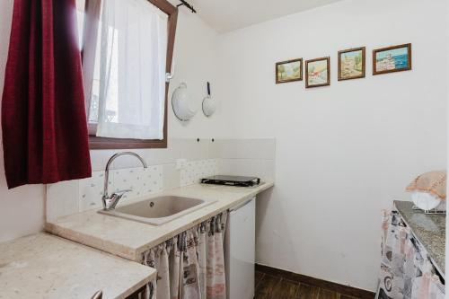 a kitchen with a sink and a window at Siciliantica - Rilievo in Rilievo
