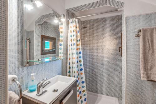 a bathroom with a sink and a shower at Can Parets in Santanyi