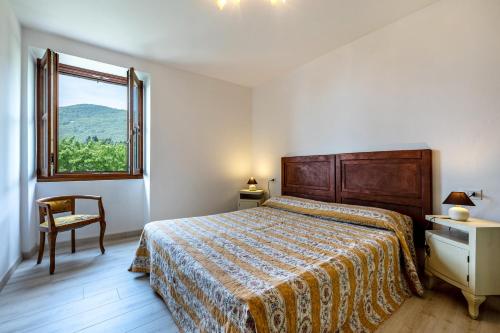 a bedroom with a bed and a window at Nonna Gina in Tignale