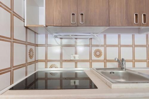 a kitchen with a sink and a counter top at Marilleva 900 Terminal in Mezzana