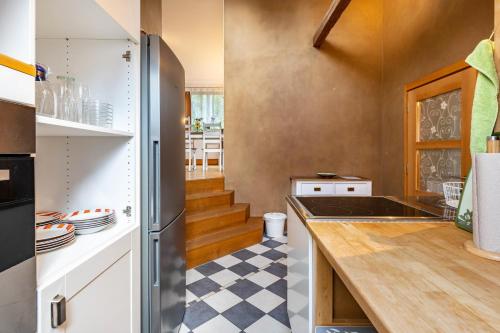 a kitchen with white cabinets and a counter top at Hof Wegwarte in Weilheim