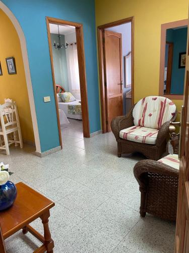 a living room with a couch and a chair at La Granja in Los Llanos de Aridane