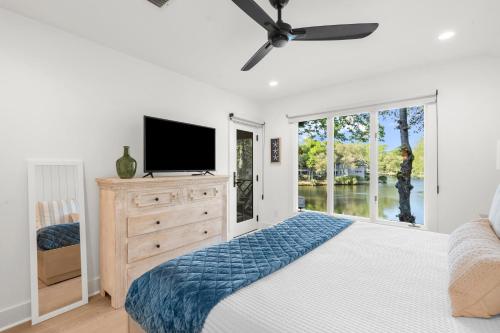 a bedroom with a bed and a tv on a dresser at 4826 Green Dolphin Way in Kiawah Island