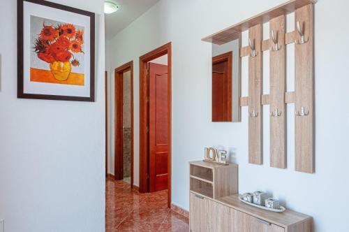 a hallway with two mirrors on the wall at Sunset El Tejar in Almogía