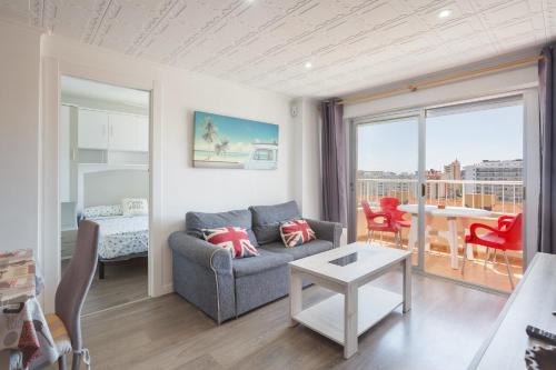 a living room with a couch and a table at Gandiazar Beach in Playa de Gandia