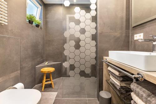 a bathroom with a sink and a toilet at Premium Basislager in Albstadt