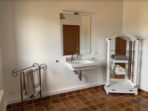 a bathroom with a sink and a mirror at Es Fasser in Son Servera