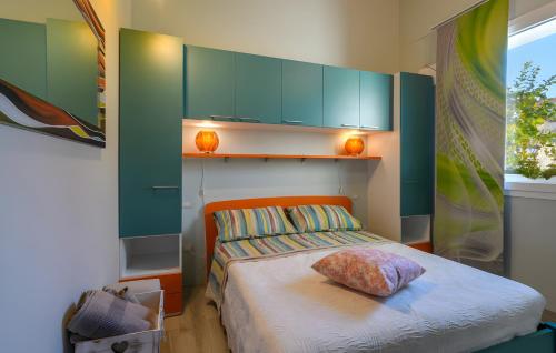 a bedroom with a bed with a pillow on it at Chalet al mare in Mondolfo
