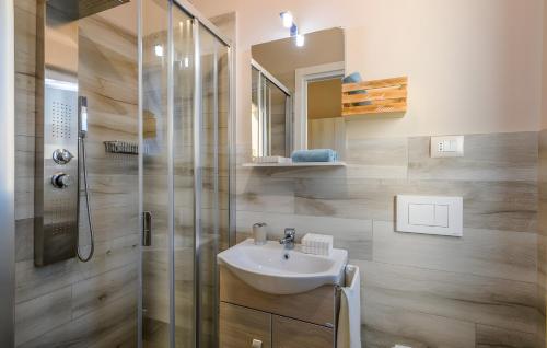 a bathroom with a sink and a shower at Chalet al mare in Mondolfo