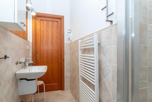 a bathroom with a sink and a shower at A 101 Puntavilla Mare in La Maddalena