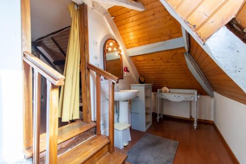 a bathroom with a sink in a attic at Gite à la campagne in Ginestet