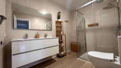 a bathroom with a sink and a shower at Casa Lydia in Torrox Costa