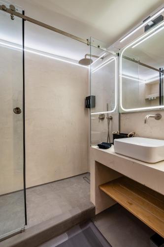 a bathroom with a sink and a shower at The Apex Boutique Apartment B2 in Athens