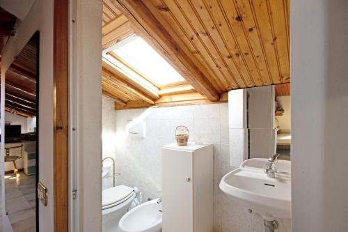 a bathroom with a sink and a toilet at Ca Olivella in Casarza Ligure