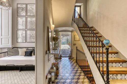 a hallway with a staircase leading to a bedroom at Casa señorial 14 personas -C. Brava in Palafrugell