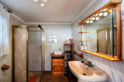 a bathroom with a sink and a shower at Villa Amorós in Cala Ratjada