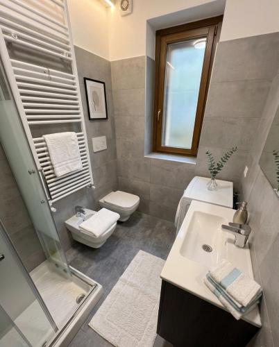 a bathroom with a sink and a toilet and a shower at a casa di ASIA in Dalmine