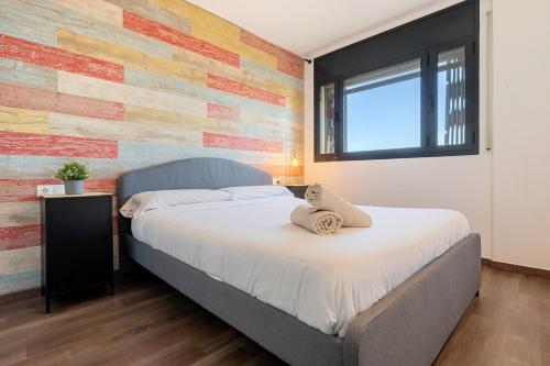 a bedroom with a large bed with a flag themed wall at Sunset- Spa and Bbq in Calafell