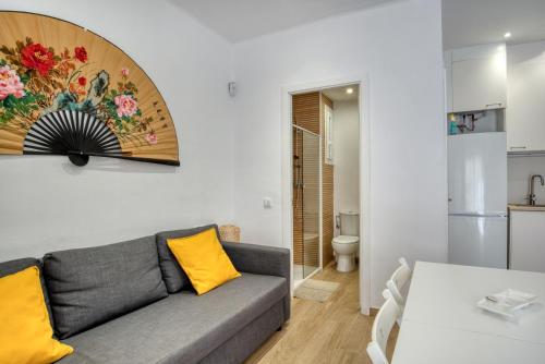 a living room with a couch and a table at Old Side Platja d Aro in Platja d'Aro