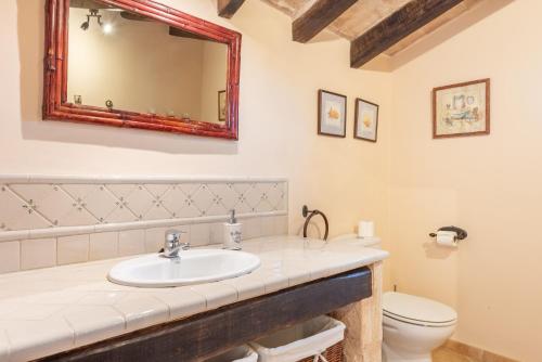 a bathroom with a sink and a toilet at Can Xuri in Campos