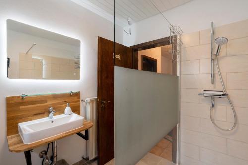 a bathroom with a sink and a shower at Ferienwohnung Kühlmeyer in Bundenthal