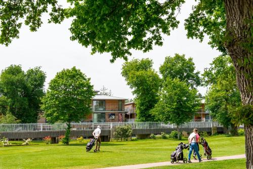 people walking in the park with their strollers at Domaine de Cicé-Blossac, Resort Spa & Golf in Bruz