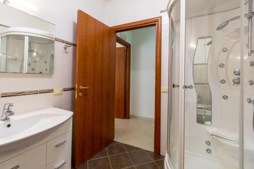 a bathroom with a sink and a shower at Ragusa 59 in Ragusa